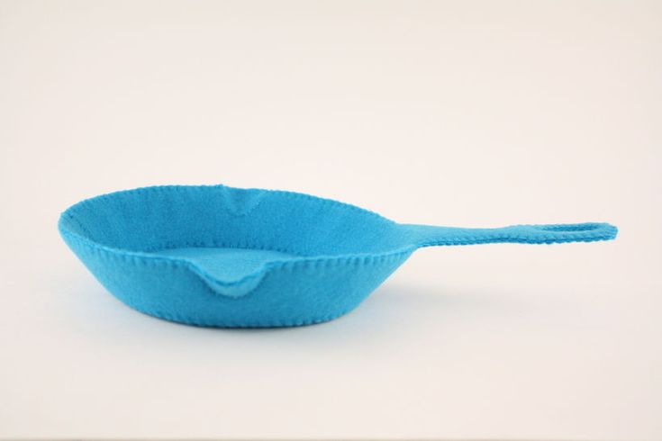 a blue bowl with a spoon in it