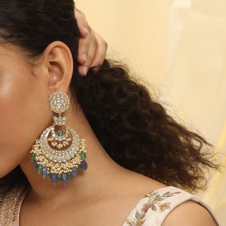 Description A vintage heirloom, our Sarika silver chandbali is inspired from timeless Indian jewelry featuring the iconic Indian crescent motif. This earring is infused with hundreds of polki crystals that add a brilliant sparkle to the design. This chaandbali is part of Shruti Haasan edit, designed by the Creative Director at Paksha. A great look for both weddings and special occasions. Product Information Metal: 925 Silver with 1.0 microns Gold Plating Length: 11 cm Stones: Semi precious pearl Chandbali Jeweled Bridal Earrings For Reception, Jeweled Chandbali Bridal Earrings For Reception, Heavy Chandbalis For Reception, Silver Jeweled Chandbali Chandelier Earrings, Jeweled Chandbali Earrings For Reception, Kundan Chandelier Earrings For Reception, Jeweled Chandbalis For Reception, Reception Chandbali Earrings With Jeweled Details, Jeweled Chandbalis For Reception And Festivals