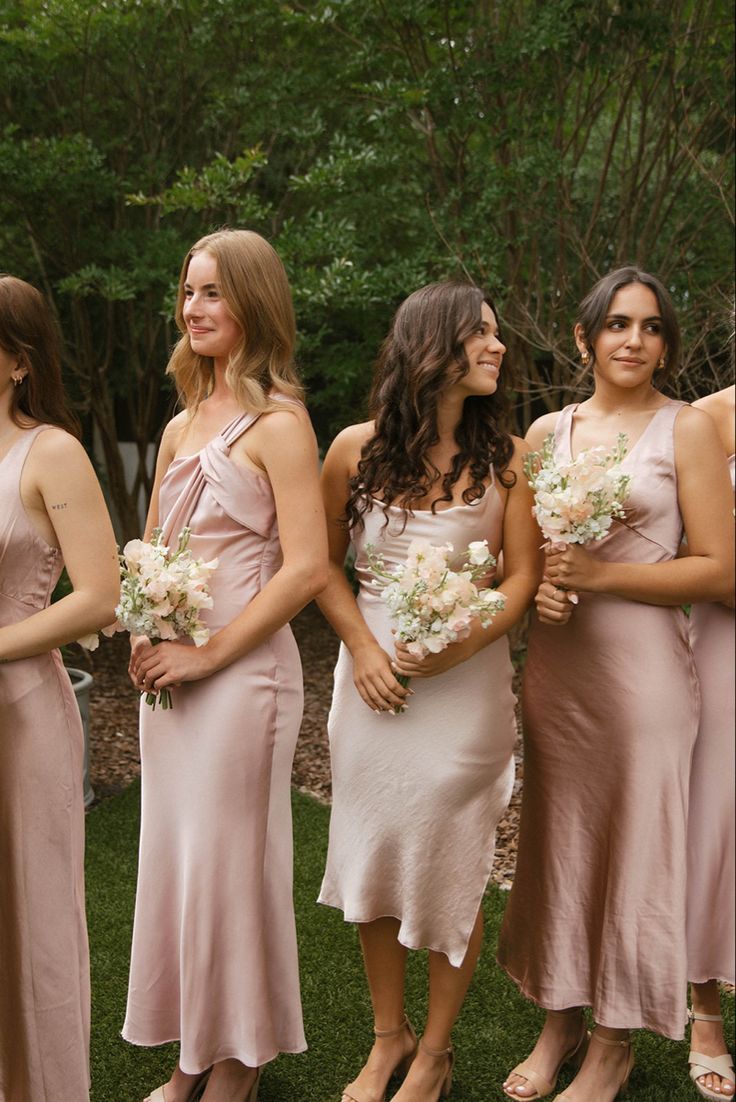 the bridesmaids are all dressed in pink dresses