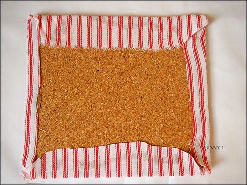 a piece of bread that is sitting on top of a tablecloth with red and white stripes