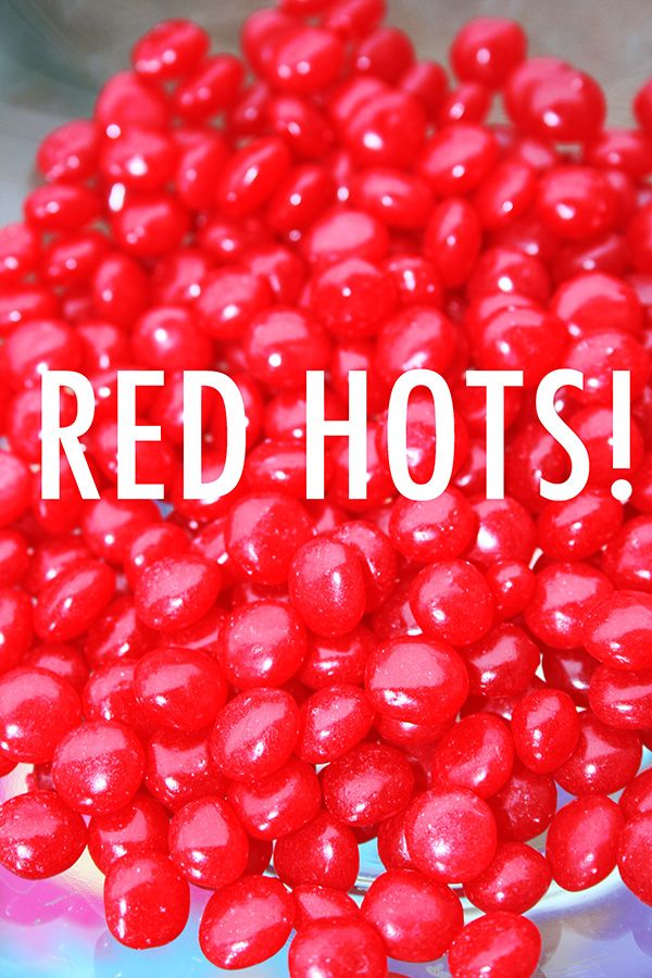 red hots on a plate with the words red hots above it in white letters