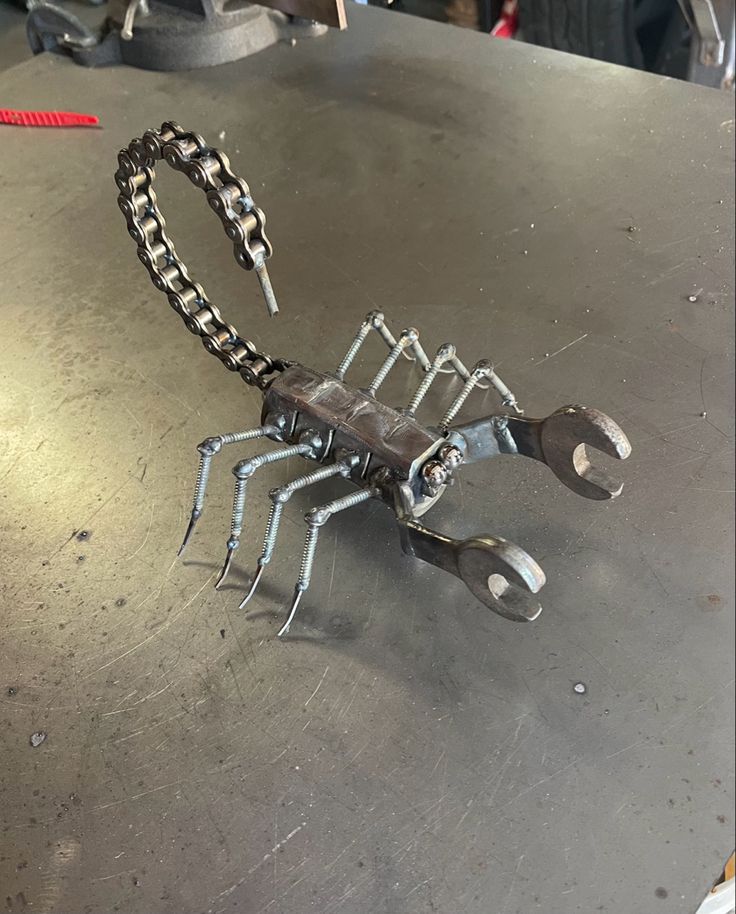 there is a metal crab on the table