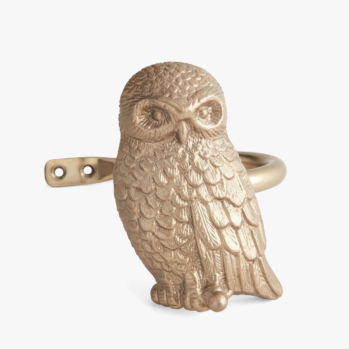 an owl shaped ring is shown on a white background