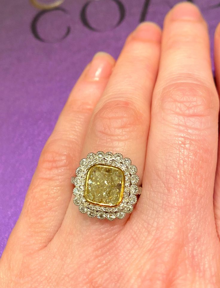 Gorgeous platinum and gold ring, centering a 3.01ct sqaure cushion-cut fancy yellow diamond set in 18k yellow gold bezel. Framed by two rows of round brilliant-cut diamonds totaling 1.12ct. 3.01ct t.w. Cushion-Cut Fancy Yellow Diamond 1.12ct t.w. Round Brilliant Cut Diamonds, G color VS clarity 18k yellow gold Platinum Yellow Platinum Diamond Wedding Ring, Luxury Yellow Diamond Ring, Formal Yellow Diamond Ring With Single Cut Diamonds, Formal Yellow Diamond Ring With Single Cut, Yellow Platinum Diamond Ring Fine Jewelry, Yellow Diamond Platinum Ring With Center Stone, Luxury Yellow Rings With Single Cut Diamonds, Fine Jewelry Yellow Diamond Platinum Ring, Yellow Platinum Diamond Ring