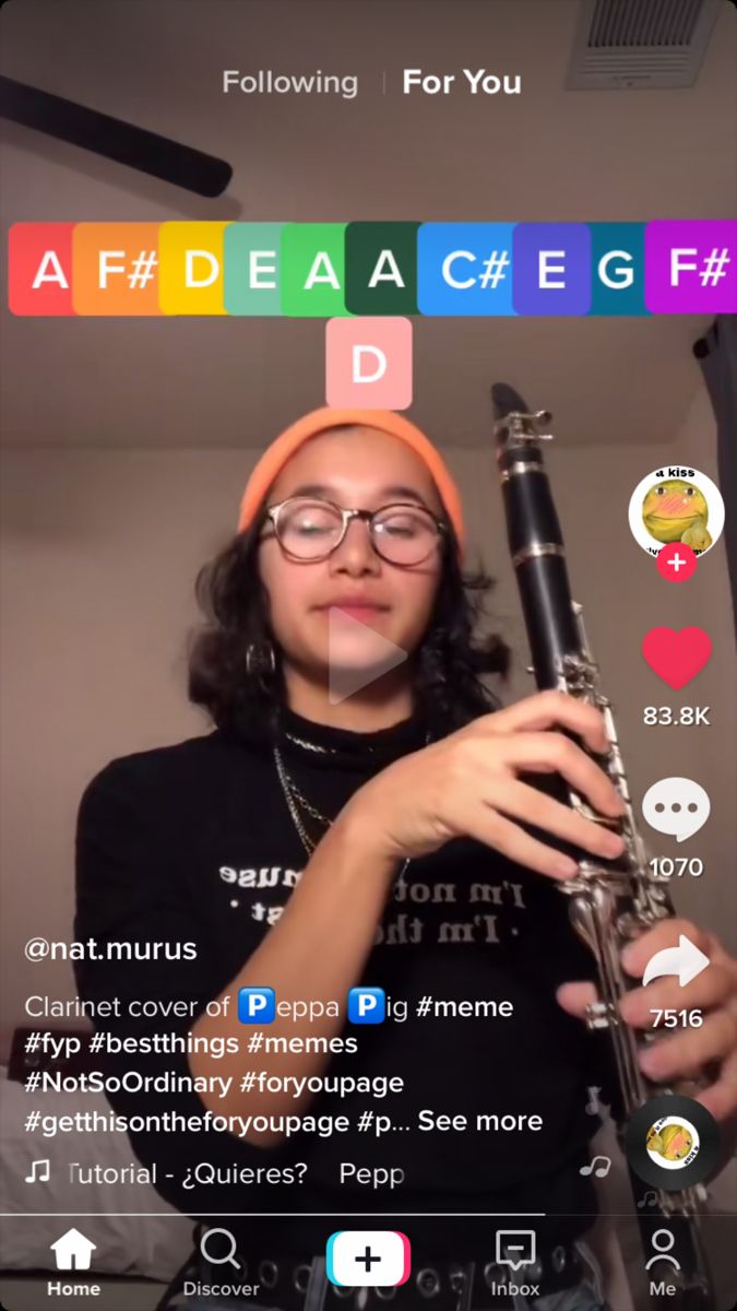 a woman holding a flute in front of her face with the words af deace e g f d on it