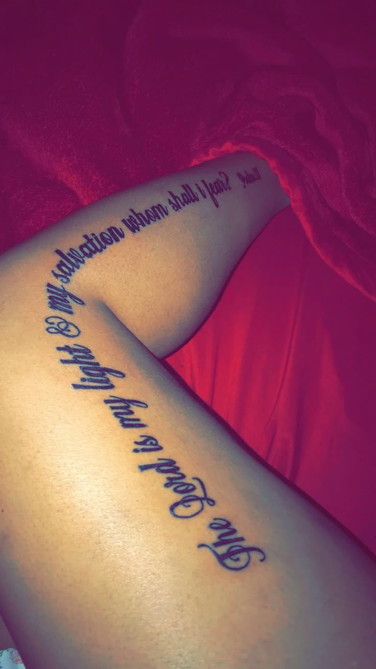 a woman laying on her stomach with a tattoo that reads, you can't stop believing