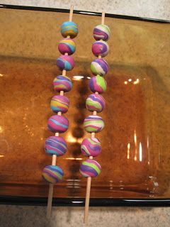 there are many colorful donuts on the stick