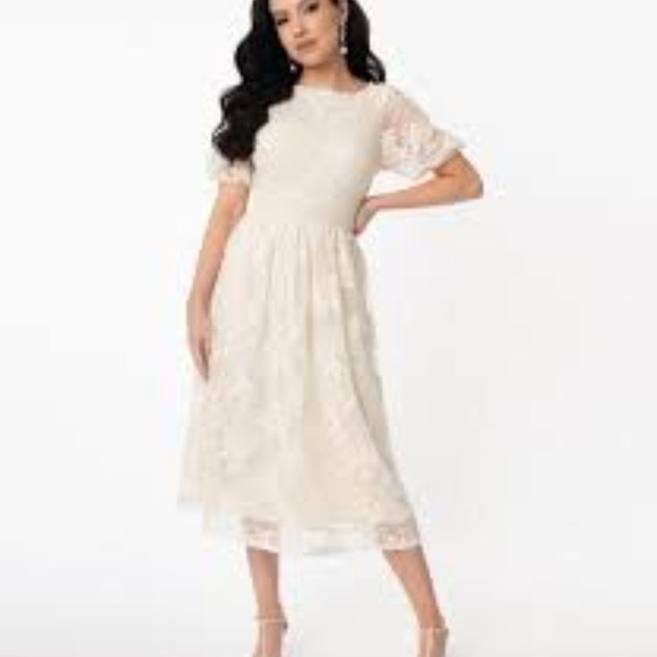 The Andie Dress Features A Modest Neckline, Framed By Puffy Short Sleeves, Cinched With Elastic Cuffs While The Embroidered Waist Is Cinched With A Back Zipper. The Charming Midi Skirt Drops Past Your Knees Over Off White Lining For A Confident And Radiant Silhouette! 80% Cotton And 20% Polyester Hand Wash And Line Dry Lined, Back Zipper Material Has Stretch Pit To Pit 19" Waist 16" Fully Lined Vintage Brand Clothing, Midi Wedding Dress, Modest Neckline, Unique Vintage Dresses, 1950s Outfits, Bridal Shower Outfit, Cream Lace Dress, Striped Mini Dress, Wiggle Dress