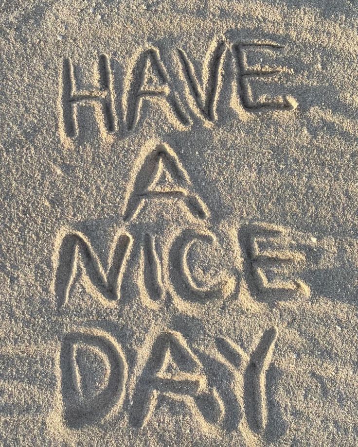 have a nice day written in the sand