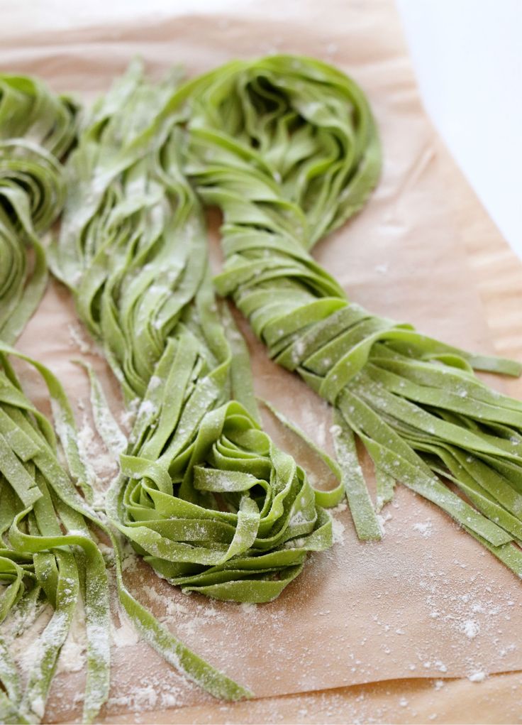 some green vegetables are on a cutting board and ready to go into the oven for cooking