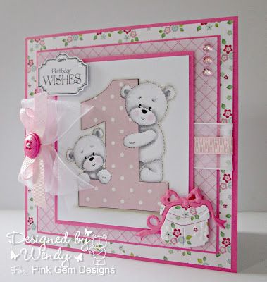 a pink and white greeting card with a teddy bear on the number one in it