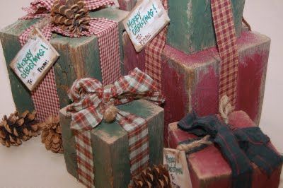 several wrapped presents with pine cones and tags on them