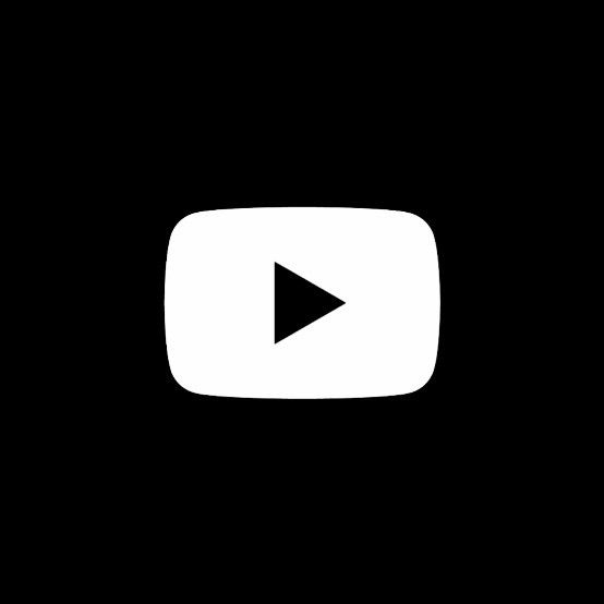 a black and white photo of a video player's play button in the dark