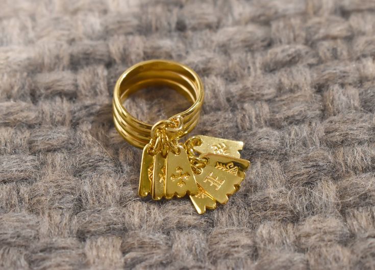 "14K yellow or rose gold-plated sterling silver 925 ring with charms. Traditional Latvian ring, called \"Seven Day Ring\" or \"Bride's Ring\". Handmade by a jeweler with more than 25 years of experience in jewelry creating. Please note, that the color of the gold-plating can slightly differ from the pictures, because the colors may differ on each monitor/ phone screen. The same design ring in sterling silver you can find here: https://www.etsy.com/listing/1194328604/ This ring contains seven Bal Ring Charm Jewelry, Gold Ring With Charms, Gold Jewelry With Dangling Charms For Birthday, Gold Jewelry With Dangling Charms For Anniversary, Gold Stackable Jewelry For Birthday, Gold Sterling Silver Ring For Birthday, Yellow Gold Jewelry With Dangling Charms For Anniversary, Anniversary Yellow Gold Jewelry With Dangling Charms, Latvian Ring