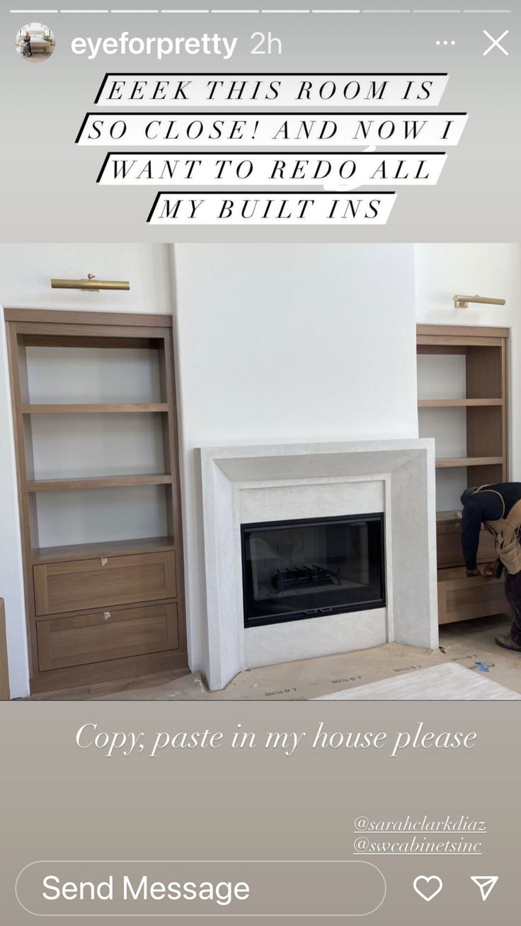 a living room with a fire place and bookcases