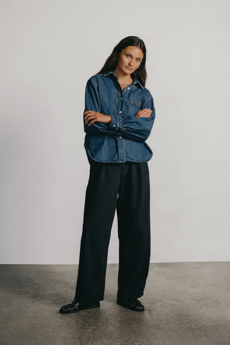 Our classic denim trouser with single front pleats and a slightly curved leg. Hitting at your natural waist, we love the Field Pants cinched with a favorite belt. Designed in our new Tencel Bull Denim, with a soft yet structured feel. It's the perfect, everyday uniform pant. Classic Workwear Jeans With Belt Loops, Dark Wash Pants With Belt Loops And Straight Hem, Classic Dark Wash Wide Leg Pants, Classic Indigo Wide Leg Bottoms, Classic Dark Wash Bottoms For Workwear, Classic Dark Wash Pants For Workwear, Classic Indigo Tapered Leg Bottoms, Classic Indigo Relaxed Fit Bottoms, Classic Dark Wash Pants With Straight Hem