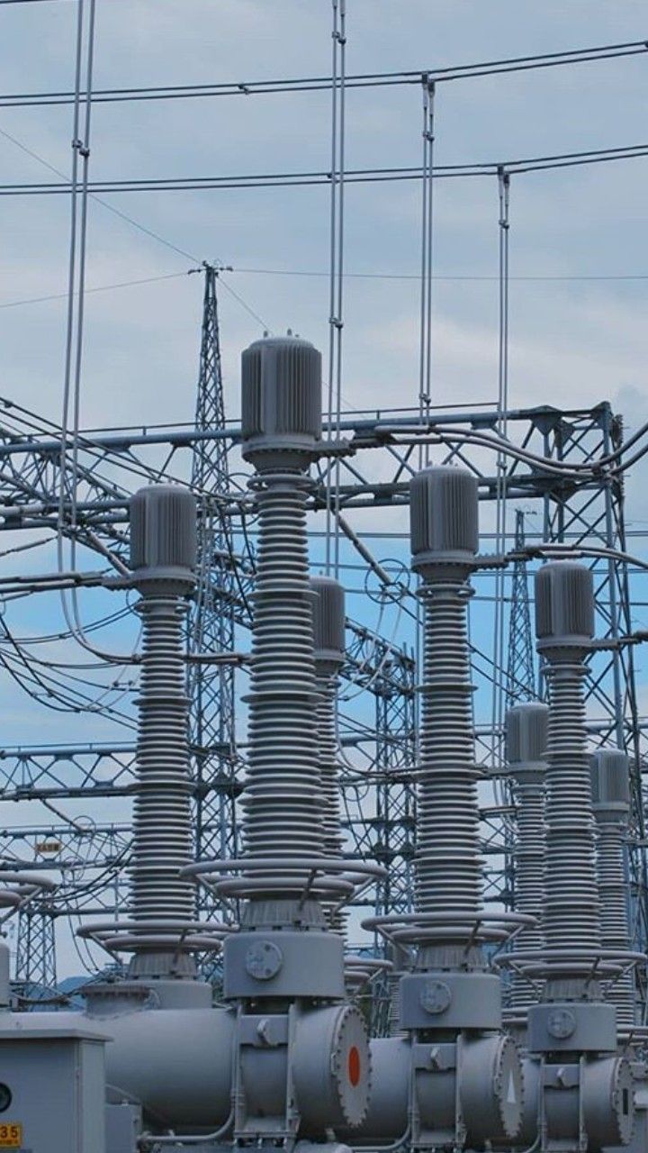 an electrical substation with many wires and poles