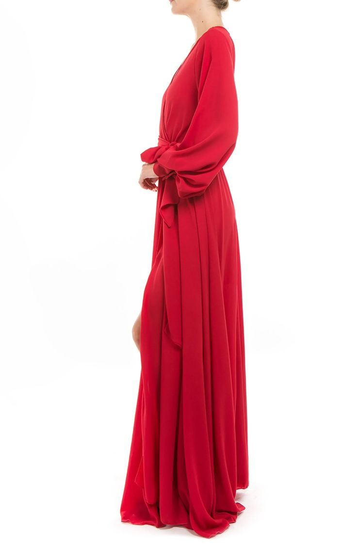 Made from lightweight opaque pebbled fabric, this maxi dress features a sweeping circle maxi skirt with a dramatic front thigh slit, perfect for making a show-stopping entrance. 56" length (size Small) Surplice V-neck Long sleeves 100% polyester with 100% rayon lining Dry clean Imported Circle Maxi Skirt, Retro Glamour, Cherry Dress, Concert Looks, Surplice Neckline, Medium Dress, 70s Inspired, Maxi Wrap Dress, Independent Designers Fashion