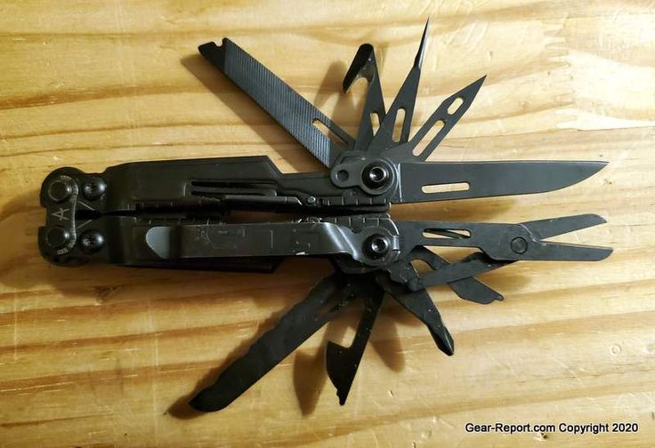 a swiss army knife with multiple blades on top of it's blade sharpener