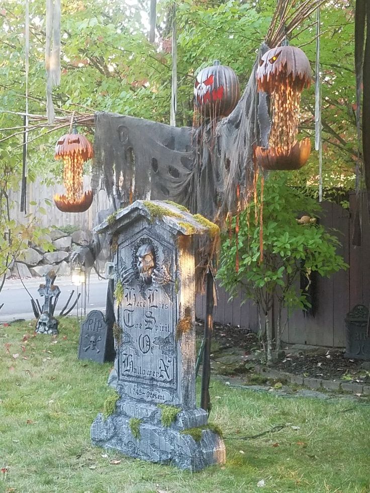 a cemetery with lights hanging from it's roof and decorations on the ground around it