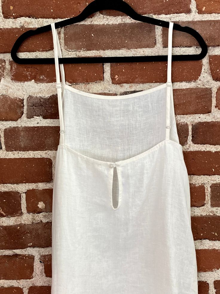 The Tripoli now comes in a shorter version. The square neck tank dress is easy to wear by the pool or at lunch. This Tripoli also has adjustable straps, 1 button keyhole closure in back, side pockets Sustainable Fabric Chic Square Neck Tank Top For Vacation, White Cotton Linen Dress With Square Neck, Chic Square Neck Linen Beach Dress, Sleeveless Linen Dress With Adjustable Straps For Day Out, Summer Linen Dress With Square Neck, White Tie-back Tank Top For Brunch, White Sleeveless Linen Dress With Tie Back, Chic Linen Tank Top With Adjustable Straps, Sleeveless Linen Dress With Adjustable Straps For Brunch