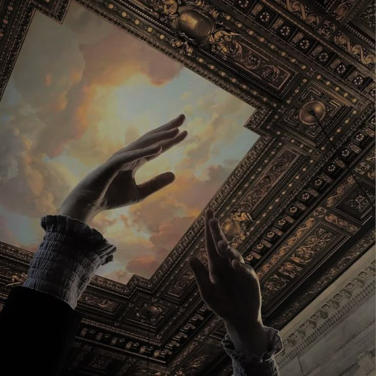 two hands reaching up into the sky above a ceiling with clouds and pillars in it