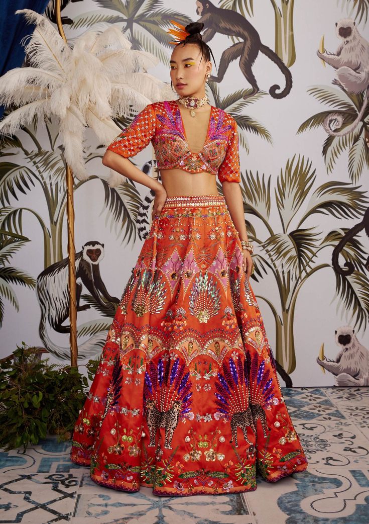 Payal And Zinal-Orange Printed Lehenga Set-INDIASPOPUP.COM Bohemian Orange Sets For Festive Occasions, Bohemian Orange Festive Sets, Festive Bohemian Orange Sets, Orange Bohemian Sets For Festivals, Bohemian Orange Choli For Wedding, Orange Bohemian Choli For Navratri, Bohemian Orange Choli For Navratri, Festive Orange Sets With Motifs, Orange Choli With Motifs For Navratri