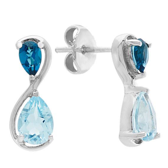 Crafted from quality sterling silver  these beautiful infinity earrings feature four pear shaped London blue topaz gemstones  at approximately 1.75 carats total weight  and are secured by friction backs and posts. Anniversary Blue Topaz Gemstone Earrings, Luxury Blue Topaz Birthstone Earrings, Nickel-free Blue Topaz Earrings, Blue Topaz Multi-stone Earrings, Luxury Multi-stone Blue Topaz Earrings, December Birthstone Jewelry, Infinity Earrings, Tanzanite Necklace, White Gold Chains