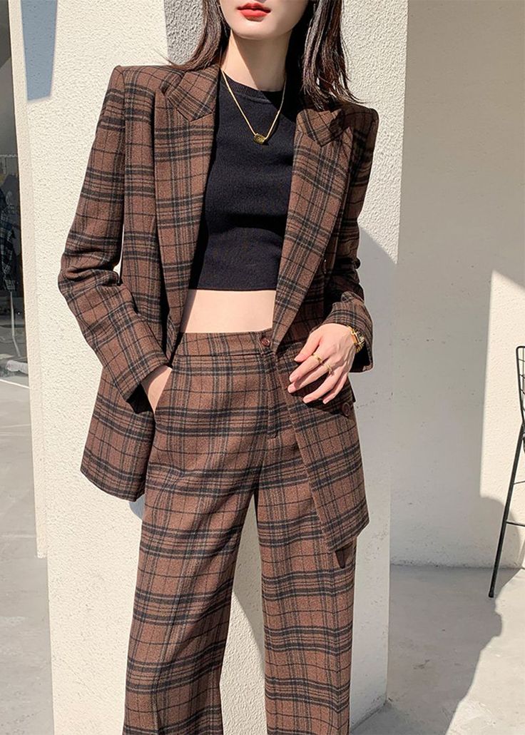 Indulge in luxury with our Nadia Coffee Plaid Blazer Wide Leg Pantsuit. This double-breasted set features a sophisticated and exclusive coffee plaid blazer and wide leg pants. Elevate your style and make a statement with this elegant and tasteful ensemble. Perfect for the fashion-forward and confident woman. Notched lapels Long sleeve Double-breasted button closure Wide leg pants Polyester,Spandex Item #241172 Women's blazer & wide-leg pants set SIZE INFO XS=US2=UK6=EU32 S=US4-6=UK8-10=EU34-36 M Brown Double-breasted Blazer For Office, Brown Workwear Sets With Suit Collar, Brown Double-breasted Fall Suit, Brown Double Breasted Suit For Fall Workwear, Brown Double-breasted Suit For Fall, Brown Suits For Fall Office Wear, Brown Suits For Office Wear In Fall, Fall Single-breasted Office Lady Pantsuit, Brown Double-breasted Suit For Office