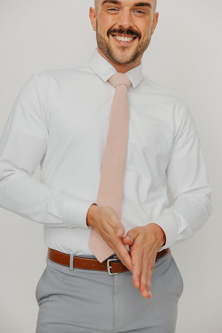 We pride ourselves in offering our customers some of the best skinny ties money can buy. Each DAZI tie is handmade from high quality imported fabrics. Features: Approx. 2.5" wide at the tip Approx. 58" in length 50% Cotton, 50% Linen Don't forget a matching pocket square! Shop our Mauve Pocket Square.