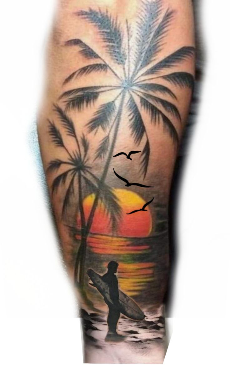 a man with a surfboard and palm tree tattoo on his arm is standing in front of the sunset