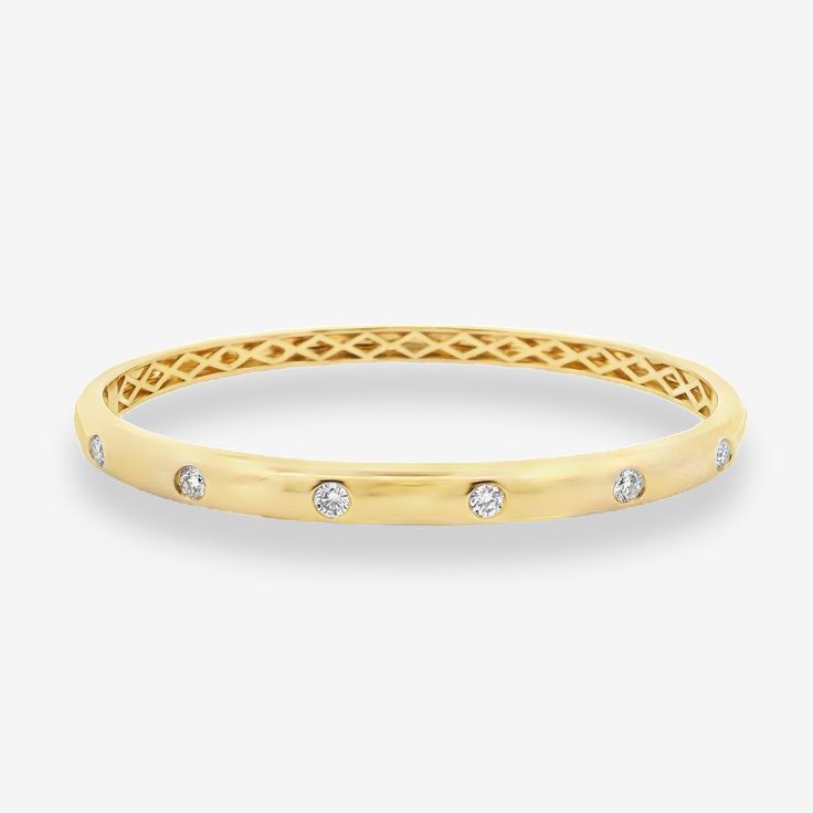 Conquer new style heights with this burnished diamond bangle! Set in 14K white or yellow gold, its stunning design is perfect for stacking and will elevate your look all day long. Wear it with our matching ring. Natural Diamonds: 0.50ctw 14K White or Yellow Gold Width: 5mm White Gold Size: 58x48mm Yellow Gold Size: 56x46mm Yellow Gold Diamond Bangle Bracelet With Accents, Yellow Gold Diamond Accent Bangle Cuff Bracelet, Elegant 14k Gold Diamond-cut Bangle, Yellow Gold Diamond Bracelets, Tarnish Resistant, Yellow Gold Diamond-accented Cuff Bangle, Diamond Bangle Bracelet, Diamond Bangles Bracelet, Matching Ring, Diamond Bangle