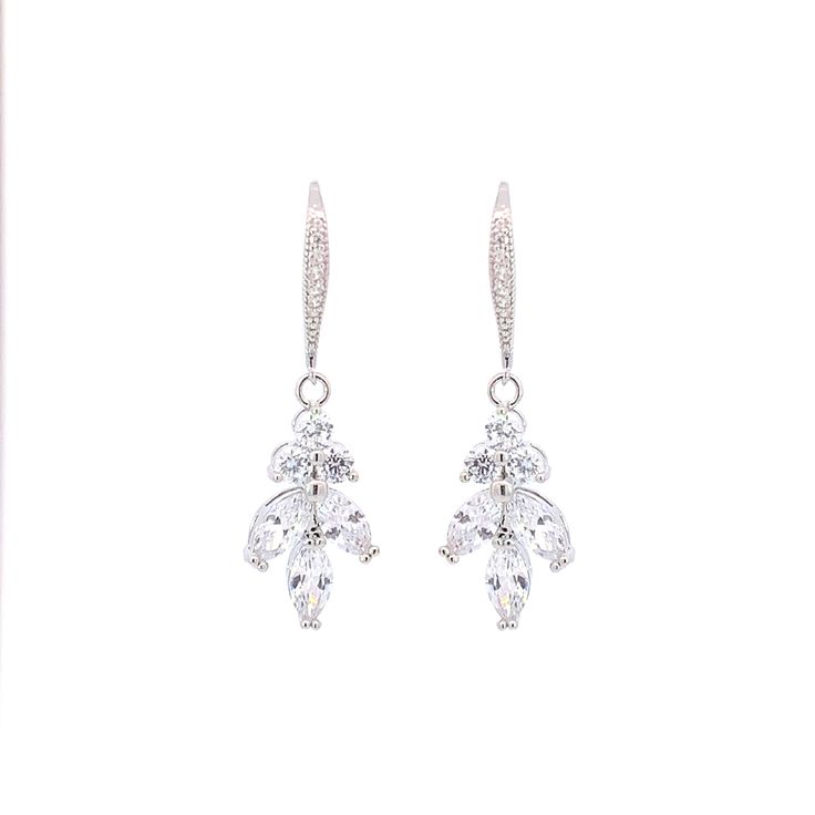 Made with petite round and marquis cut stones in a linear cluster, reminiscent of a leaf or vine with a French hook. Length: 1.5", Width: 1/2" 4.2 carat total weight Carat total weight based on diamond equivalent Custom gift box and microfiber storage pouch included Elegant Marquise Cut Cluster Earrings With Prong Setting, Elegant Marquise Cut Cluster Earrings For Formal Occasions, Elegant Marquise Cut Cluster Earrings, Elegant Marquise Crystal Earrings For Formal Occasions, Elegant Marquise Cut Cubic Zirconia Cluster Earrings, Dangle Diamond Earrings With Lever Back For Wedding, Formal Drop Cluster Earrings With Ear Wire, Custom Gift Boxes, Silver Drop Earrings