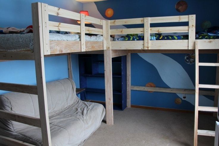 a bunk bed in a room with blue walls