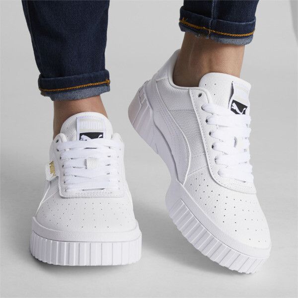 Step Up Your Sneaker Game With The Puma Cali Women's. These Sleek Black And White Leather Sneakers Are The Perfect Addition To Any Outfit, Adding A Touch Of Sporty Style To Your Everyday Look. The All-White Design Gives A Clean And Classic Feel, While The Puma Branding Adds A Touch Of Streetwear Flair. With A Comfortable Fit And Durable Construction, These Cali Sneakers Are A Must-Have For Anyone Looking To Elevate Their Footwear Collection. Stay On-Trend And Step Out In Style With The Puma Cali Puma Sneakers Outfit, Puma Sneakers Womens, Tennis Silhouette, West Coast Vibes, Shoe Goals, White Puma Sneakers, Puma Cali, Sneaker Outfits Women, White Puma