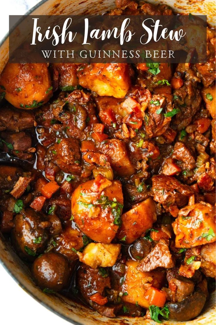 irish lamb stew with guinness beer in a skillet on a white background and text overlay