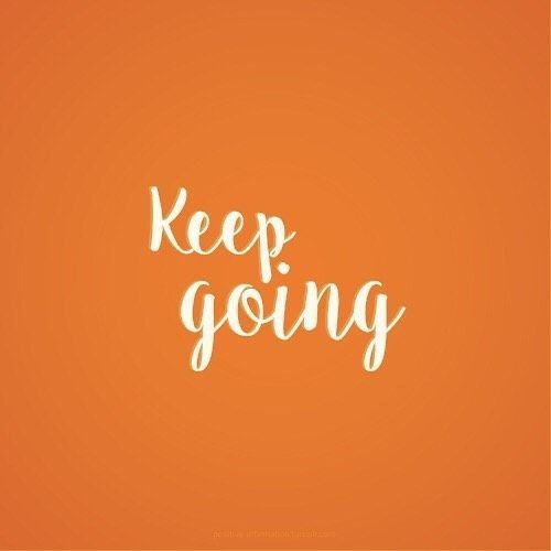 an orange background with the words keep going written in white ink on top of it