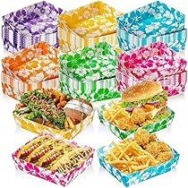 many colorful boxes filled with different types of sandwiches and french fries in each one's box