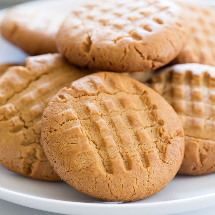 a white plate topped with cookies on top of a table