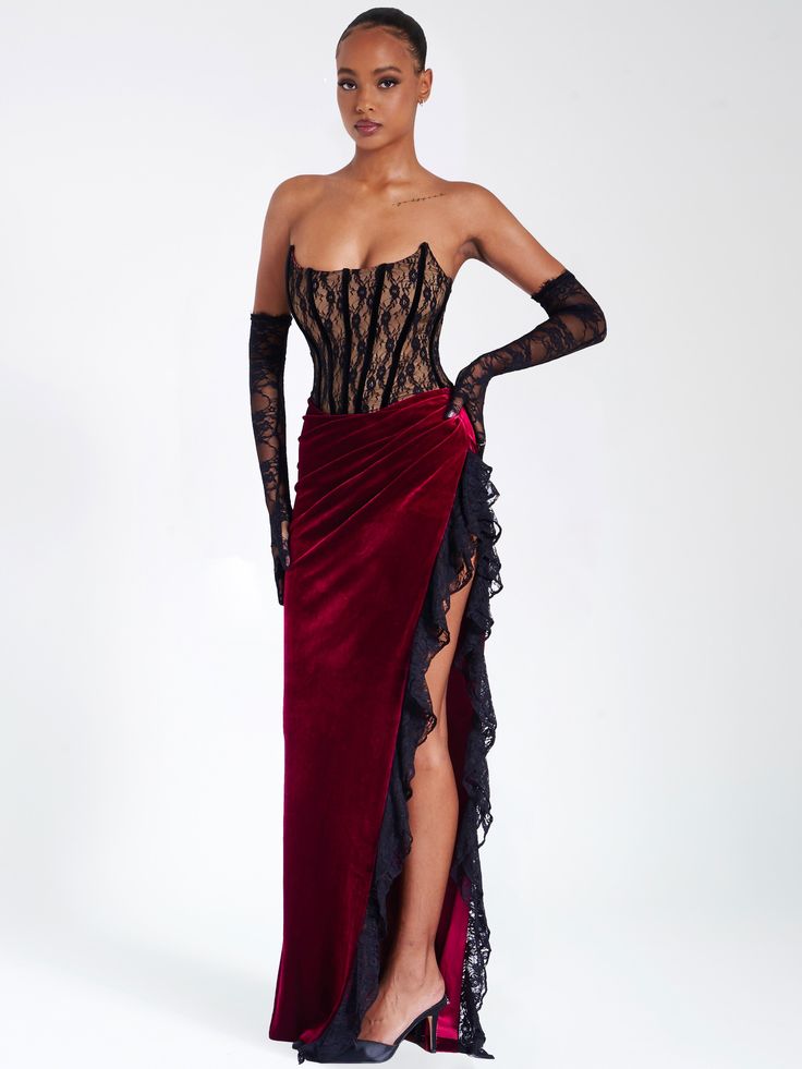 Live life like royalty with this divine piece! Featuring a strapless corset, high side slit, exposed velvet boning, and slight ruching details across the 'V' shaped waistline, it's sure to make you look and feel like a queen. Fully boned and lined with a nude-colored lining, this stunning dress is perfect for any special occasion. Now get out there and make an unforgettable statement! Pair it with our Rae Black Lace Opera-length Gloves! Available in black and red. Materials: Lace / Stretch Velve Burgundy Lace Dress, Party Maxi Dresses, Boudiour Poses, Split Dress Thigh, Velvet Patchwork, Fitted Gowns, Lace Burgundy Dress, Velvet Corset, Red Corset