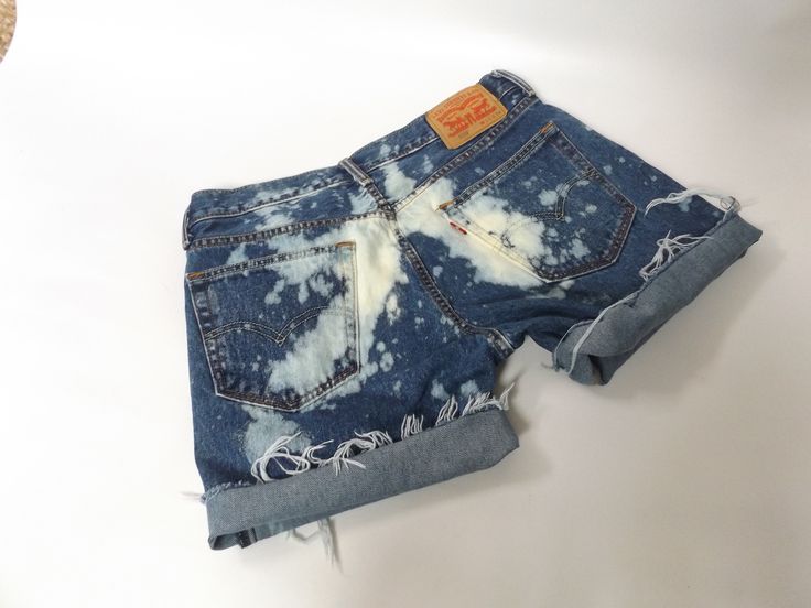 vintage 90s levi cut off blue jean shorts. distressing throughout with raw frayed bottom hem. W 33 on the tags but waist is a comfortable 34 inch waist, see measurements. LABEL || levi strauss and co. MATERIAL || cotton denim CONDITION || great distressed || ready to wear MEASUREMENTS || in inches size || W 33 on tags outside length waist to bottom || 15 1/2 inseam length || 6 rise || 10 waist lying flat doubled || 34 hips lying flat/doubled || 44 ~~see more shorts here www.etsy.com/shop/roadkil Distressed Acid Wash Jean Shorts For Summer, Dark Wash Jeans For Summer Festival, Summer Festival Dark Wash Jeans, Festival Cutoff Jean Shorts With Frayed Hem, Faded Cutoff Jean Shorts For Summer, Faded Distressed Jean Shorts For Summer, Grunge Cutoff Jean Shorts For Summer, Trendy Cutoff Jean Shorts For Festival, Hippie Style Blue Jeans For Summer