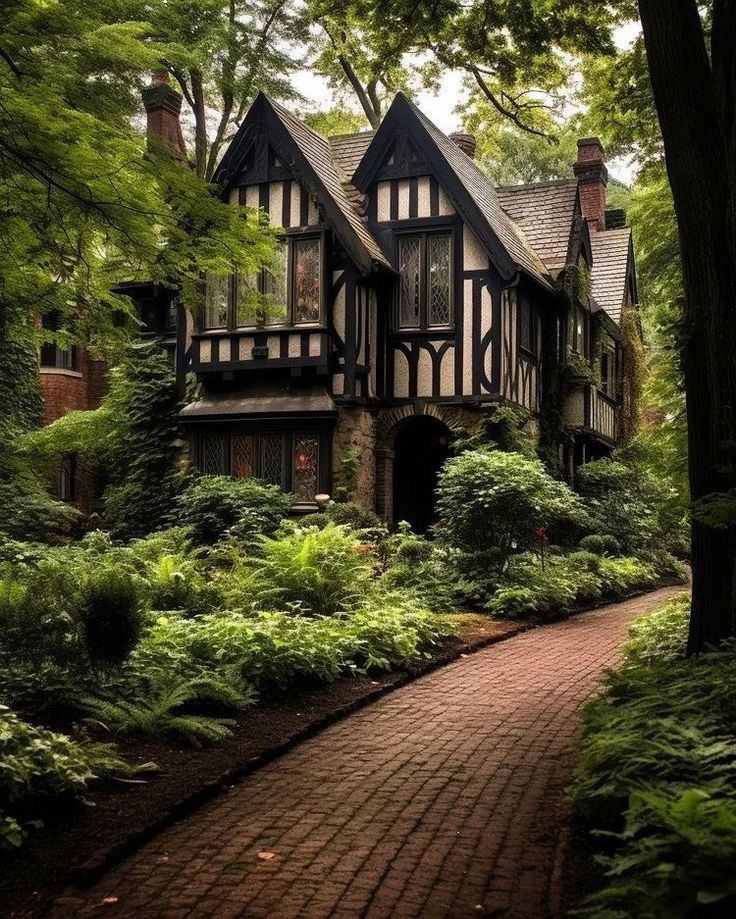 an old style house surrounded by trees and bushes