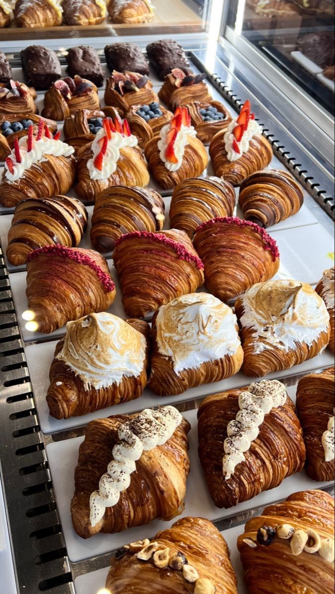 there are many different types of pastries on display