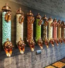 a row of wall mounted candy dispensers