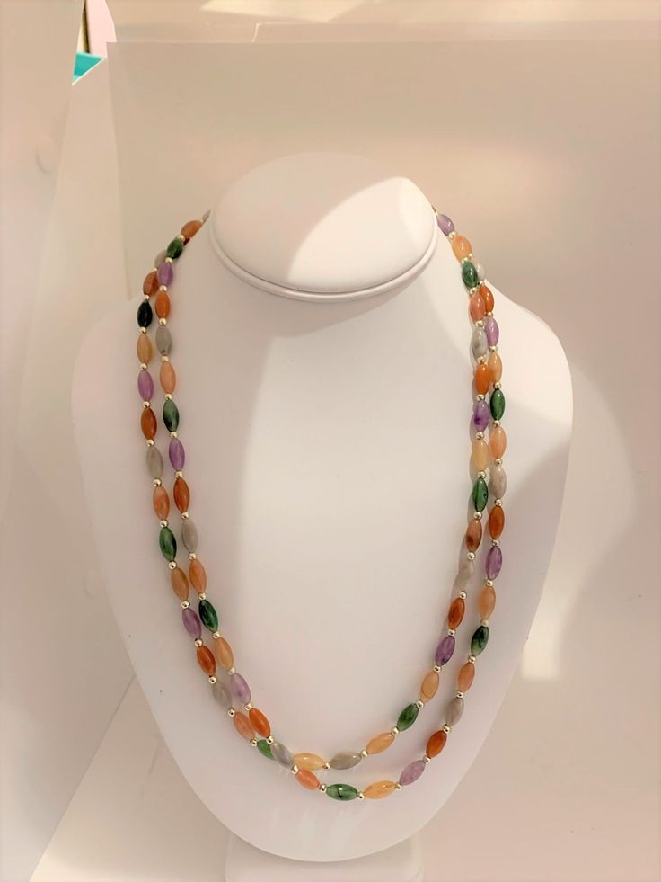 Multicolored barrel beaded string necklace. Long enough to loop and make a double strand. Multicolor Double Strand Gemstone Beads, Multicolor Gemstone Beads Double Strand, Small Beaded Necklace, String Necklace, Chanel Box, Rose Bracelet, Locket Pendant Necklace, Coral Earrings, Necklace Long