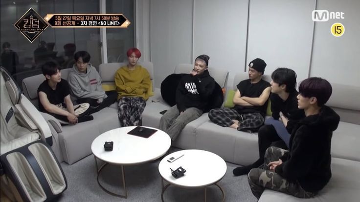 a group of people sitting on couches in a room