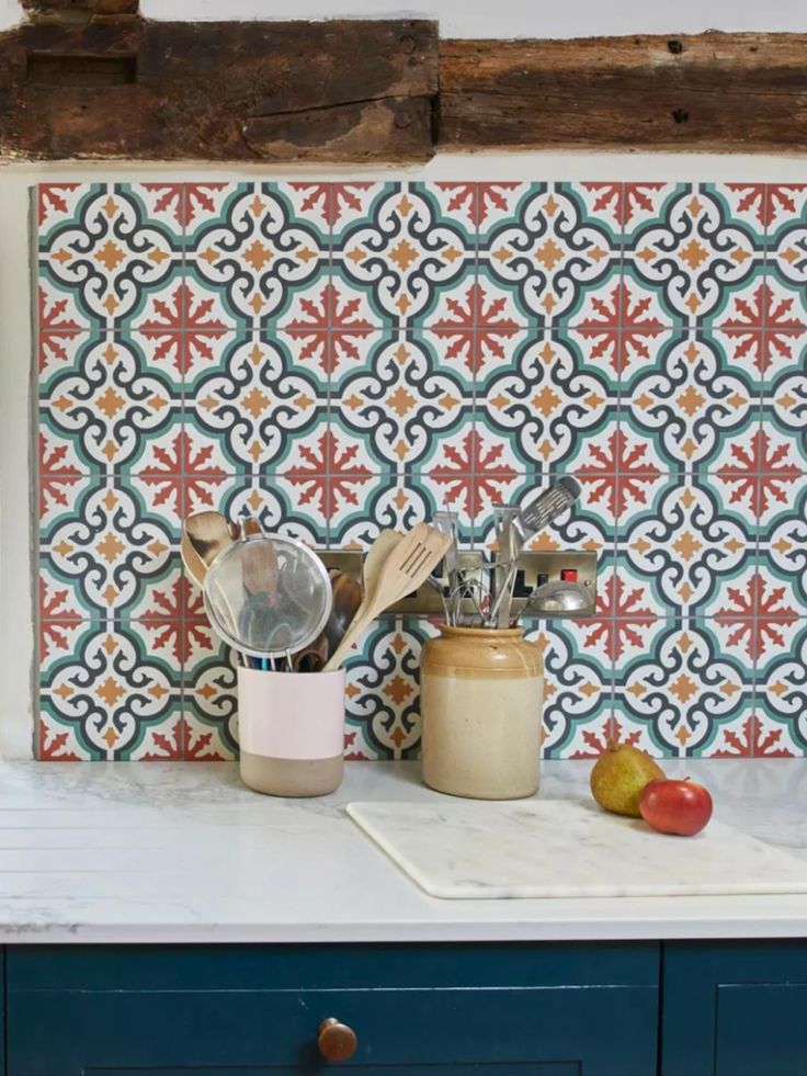 kitchen utensils on top of a blue cabinet