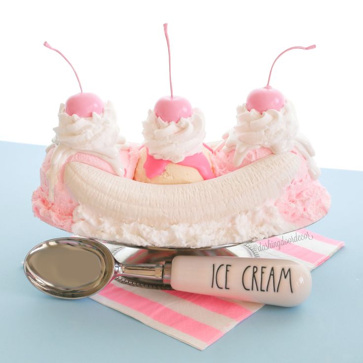 a cake shaped like a banana split with ice cream on top