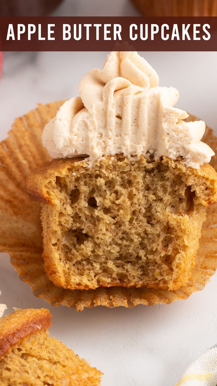 an apple cupcake is cut in half and sitting on top of some muffins