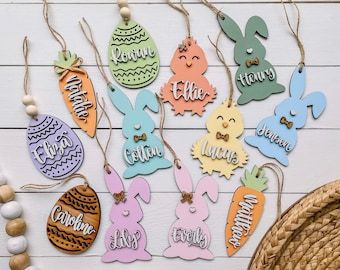 an assortment of wooden easter decorations on a table